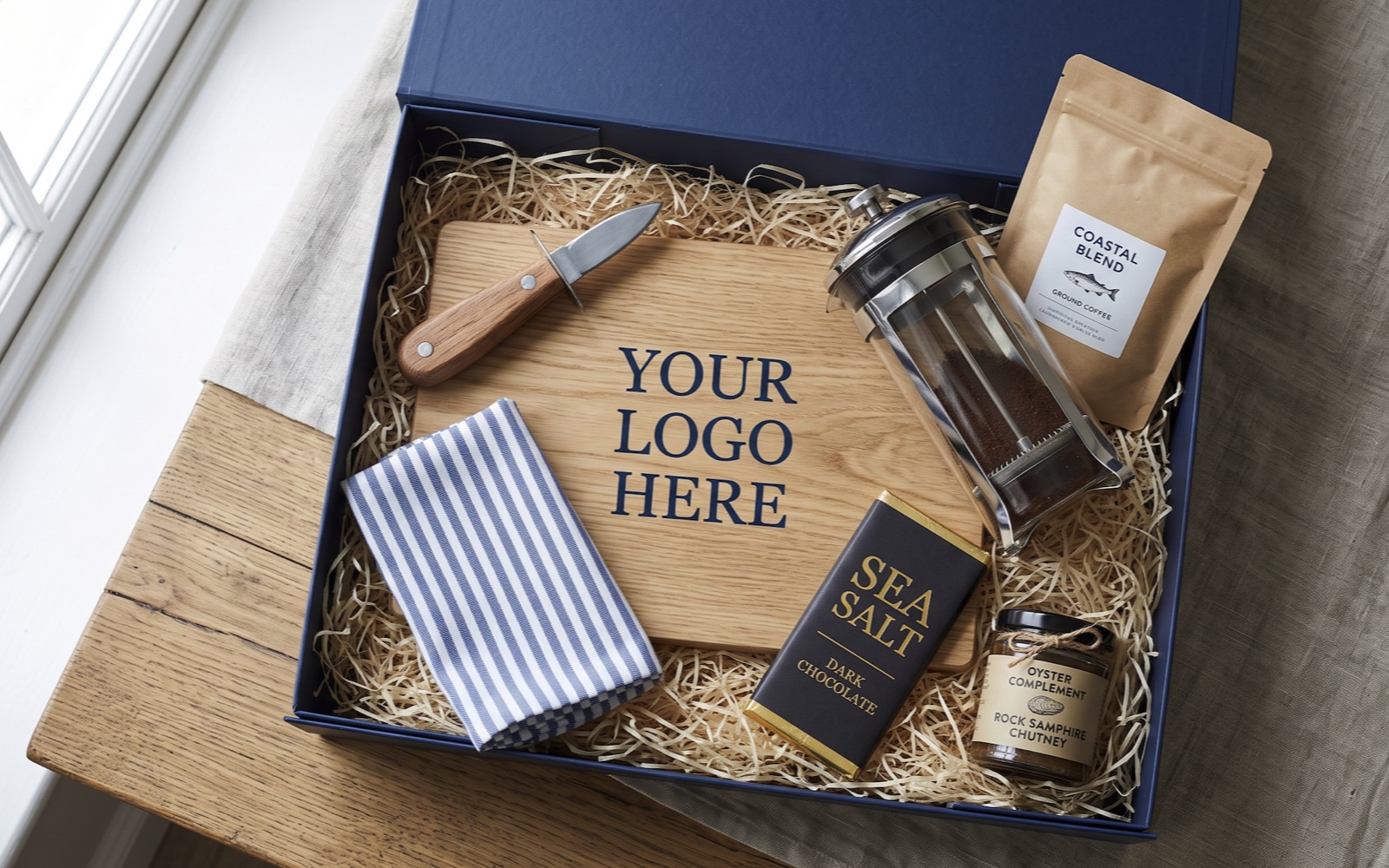 Coastal-themed gift box with oyster knife, sea salt chocolate and coastal blend coffee